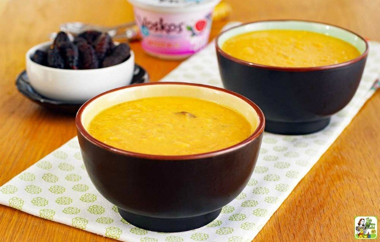 Bowls of Sweet Potato Soup, a bowl of figs, and a cup of yogurt.