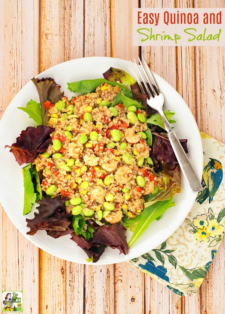 Plate of Quinoa and Shrimp Salad with fork and floral napkin.