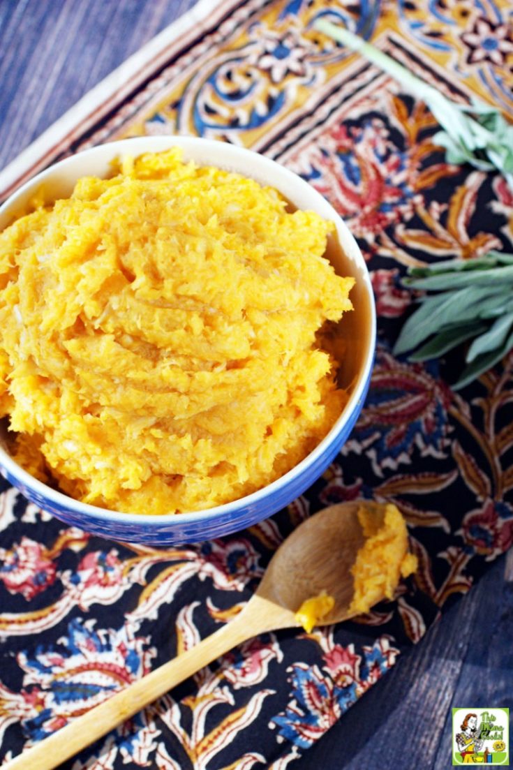 Blue bowl of Mashed Sweet Potatoes with Parsnips and wooden spoon
