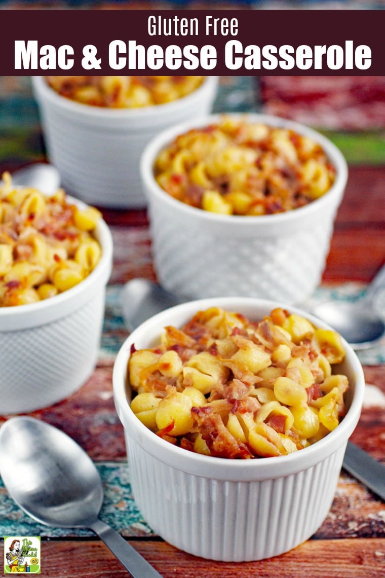 White ramekins of mac and cheese and silver spoons.