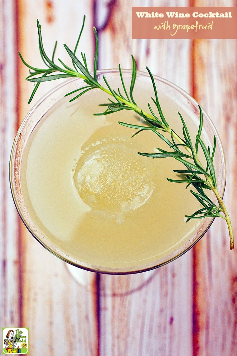 This white wine cocktail with sprig of rosemary.