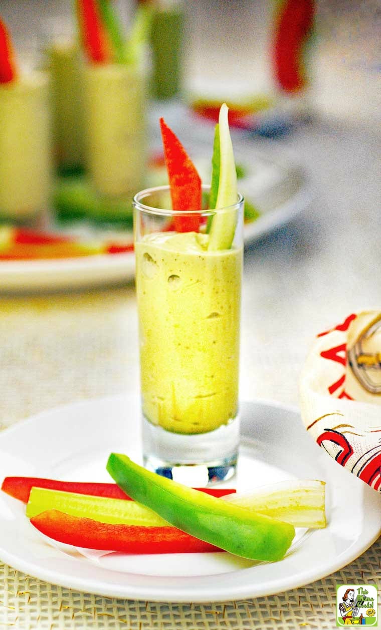 An Avocado Dip Veggie Shooter appetizer with sliced vegetables.