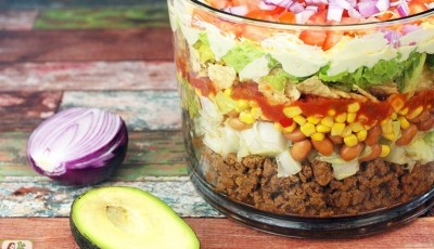 Looking for a healthy taco salad recipe for dinner? Try this Chopped & Layered Taco Salad recipe! Serve it in a trifle bowl or punch bowl. Click to get this ideal potluck taco salad recipe!