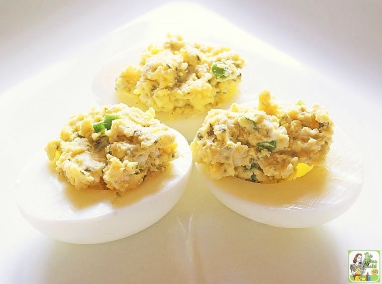 Three Blue Cheese Deviled Eggs on a white plate.