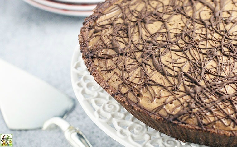 Espresso Chocolate No Bake Pie on a white cake stand with pie cutter.