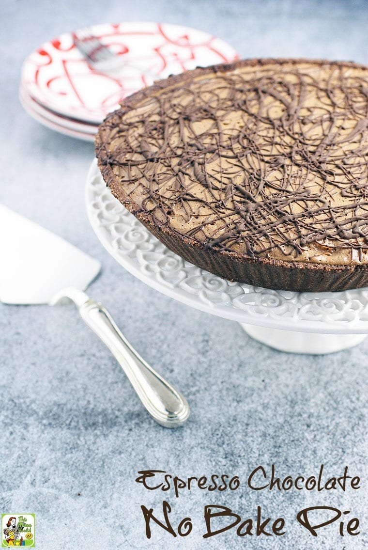 Espresso Chocolate No Bake Pie on a white cake stand with pie cutter and plates.