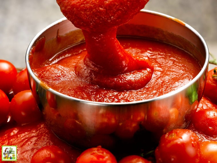 A bowl of freshly made tomato sauce and tomatoes.