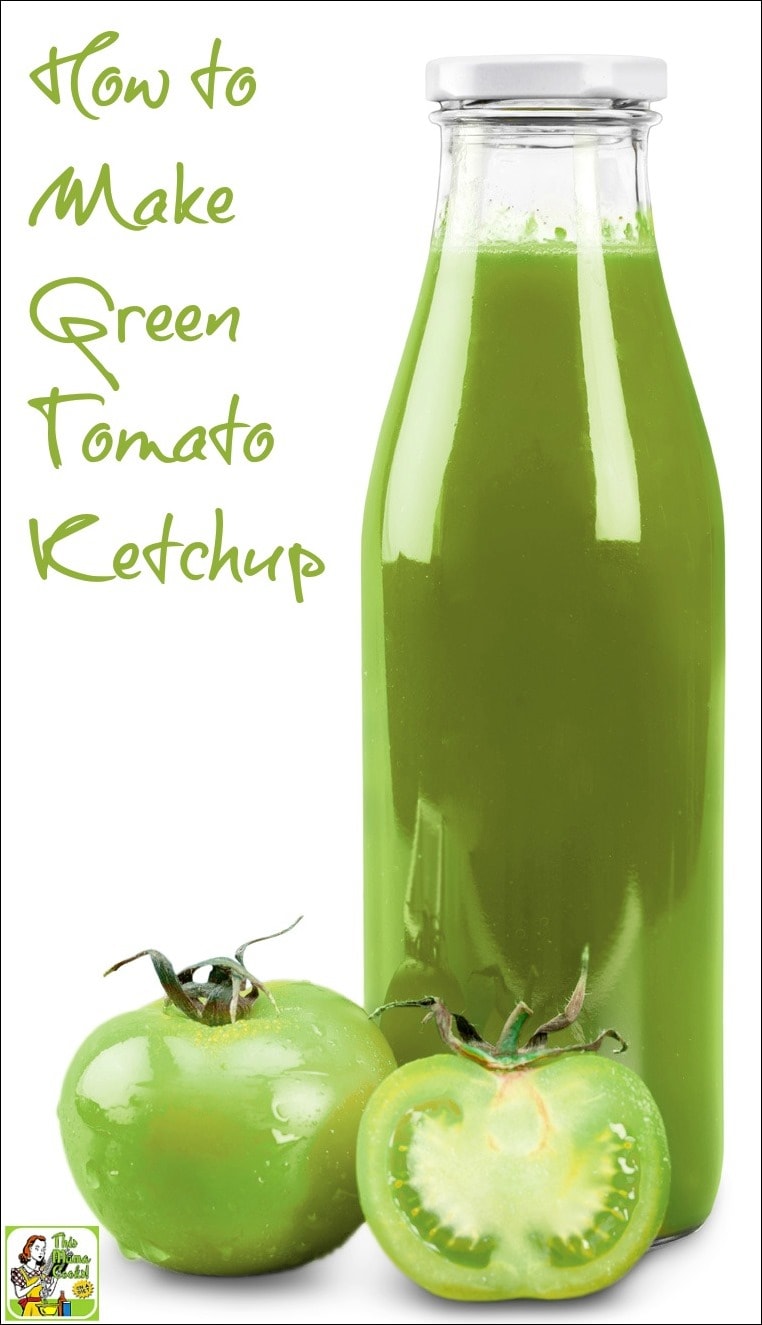 A bottle of green tomato ketchup with a couple of green tomatoes.