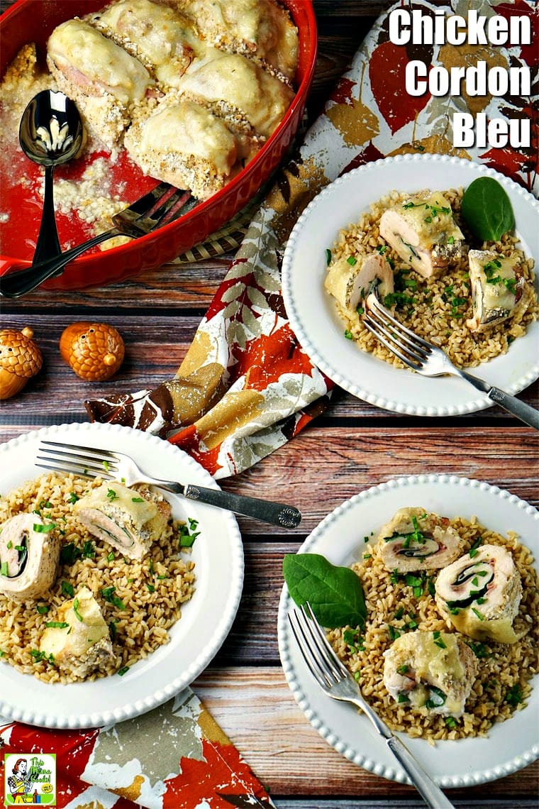 Plates of Chicken Cordon Bleu served on rice on a white plates with a silver forks with colorful napkins.