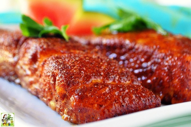 Servings of easy oven baked salmon on a white plate.