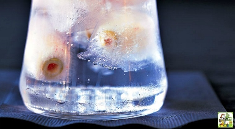 A glass of Eyeball Highball Halloween Cocktail on a black napkin.