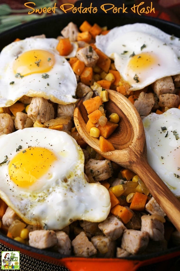 Sweet Potato Pork Hash, sunny side up eggs, and a wooden spoon