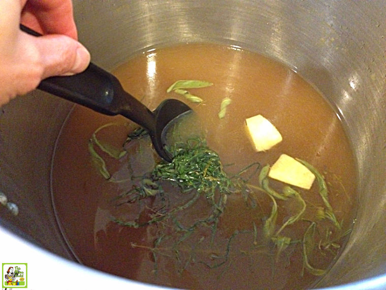 Boiling ingredients in a stock pot when making a smoked turkey breast brine.