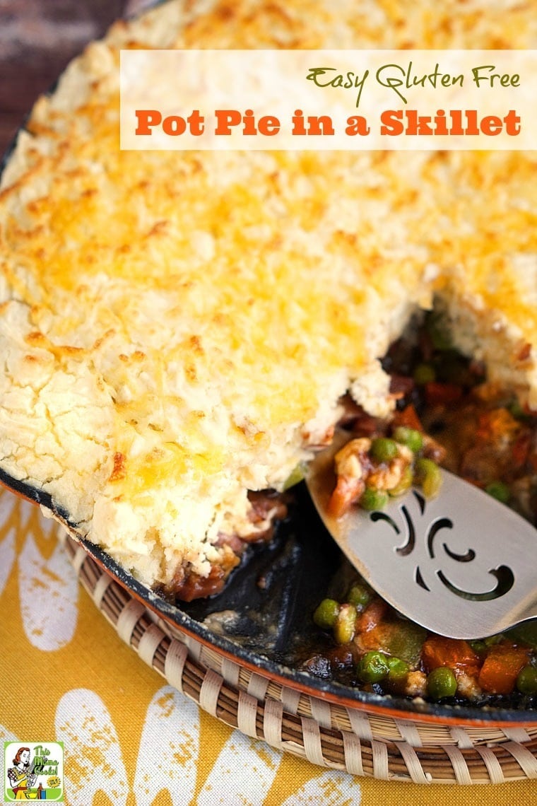 Closeup of Pot Pie served in a skillet with a silver slotted spoon 