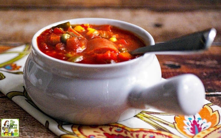 A lug handled bowl of Slow Cooker SPAM Soup with spoon and floral napkin.