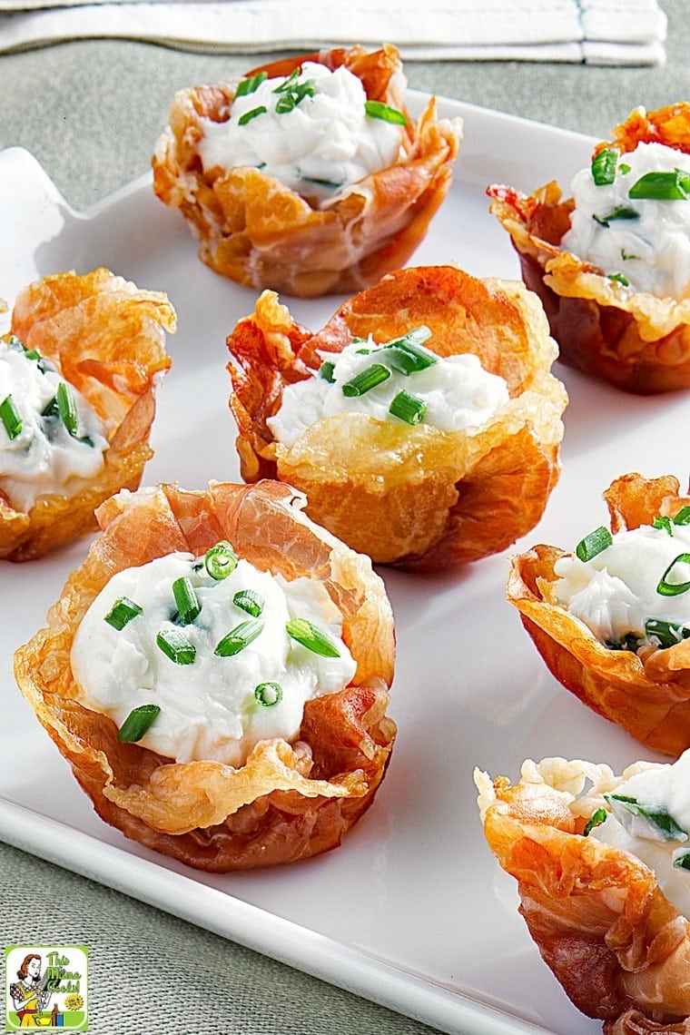 Closeup of Prosciutto Cups with Goat Cheese Mousse on a white plate.