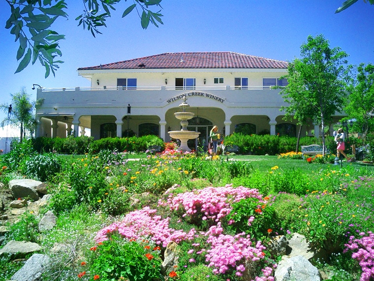 Gardens and building at the Wilson Creek Winery in Temecula, California.