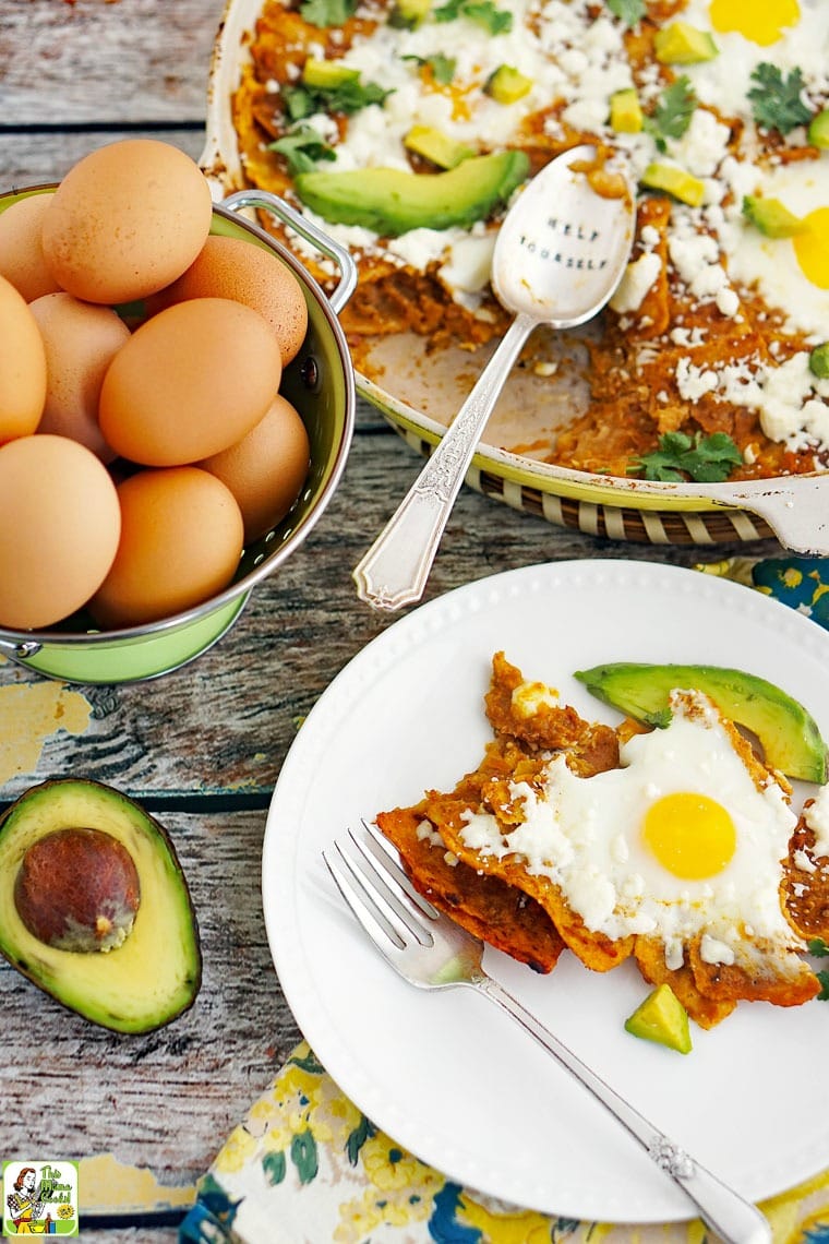 A plate of breakfast chilaquiles with eggs and avocados