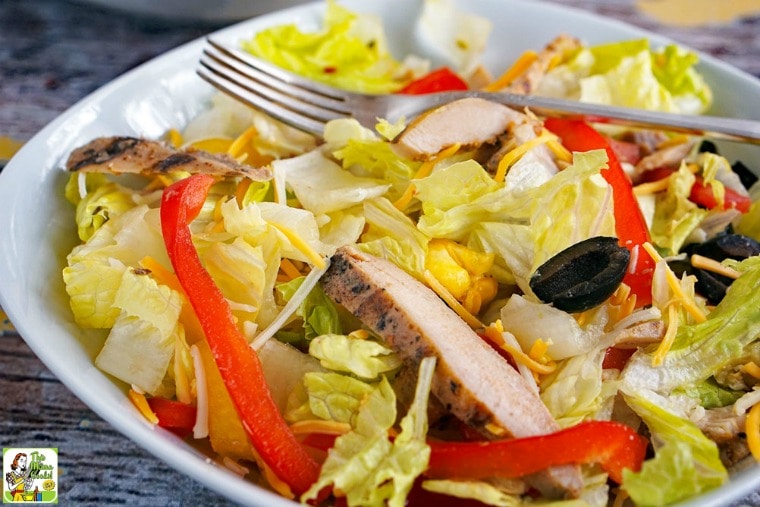 A bowl of Chicken Fajita Salad with fork.