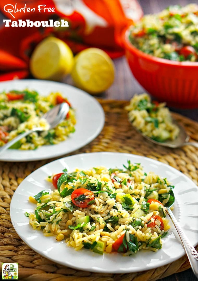 Rice tabbouleh with tomatoes and parsley on a white plate with spoon on a woven mat. 