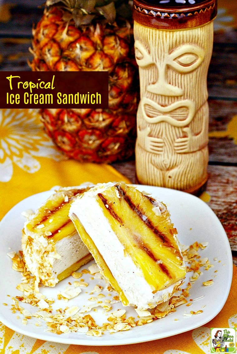 Grilled pineapple tropical ice cream sandwich on a white plate with toasted coconut.