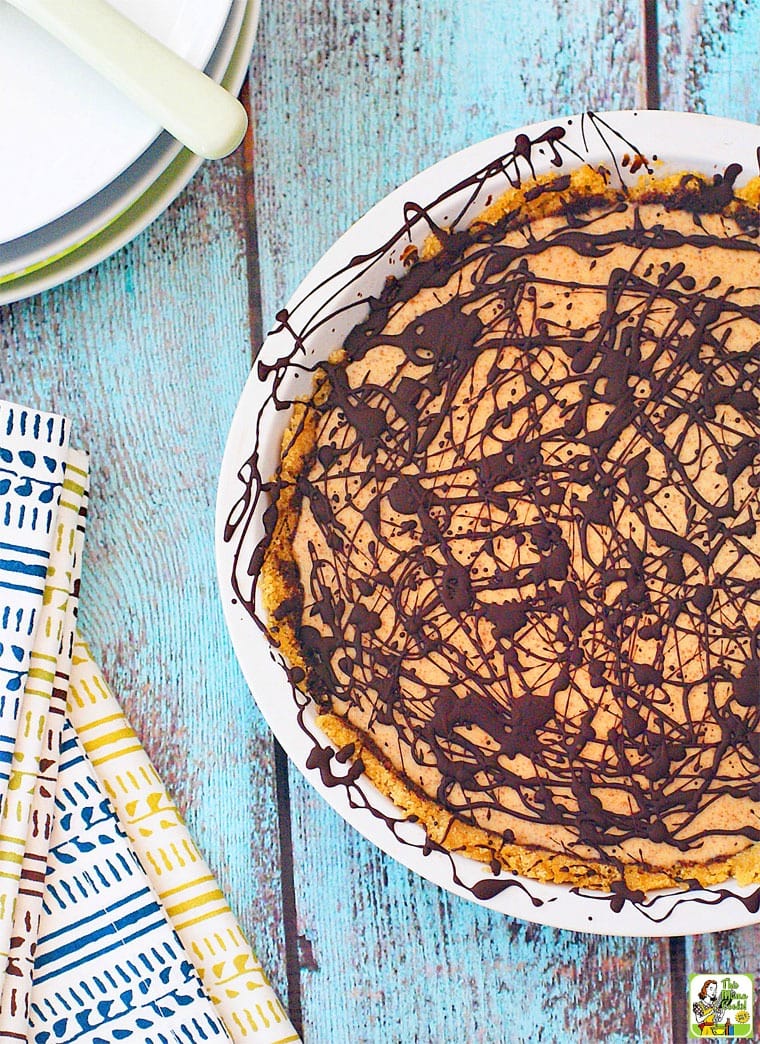 No Bake Almond Butter Pie with colorful napkins, plates, and pie server.