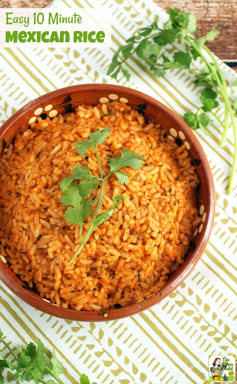 Overhead view a bowl of Mexican rice with sprigs of cilantro.