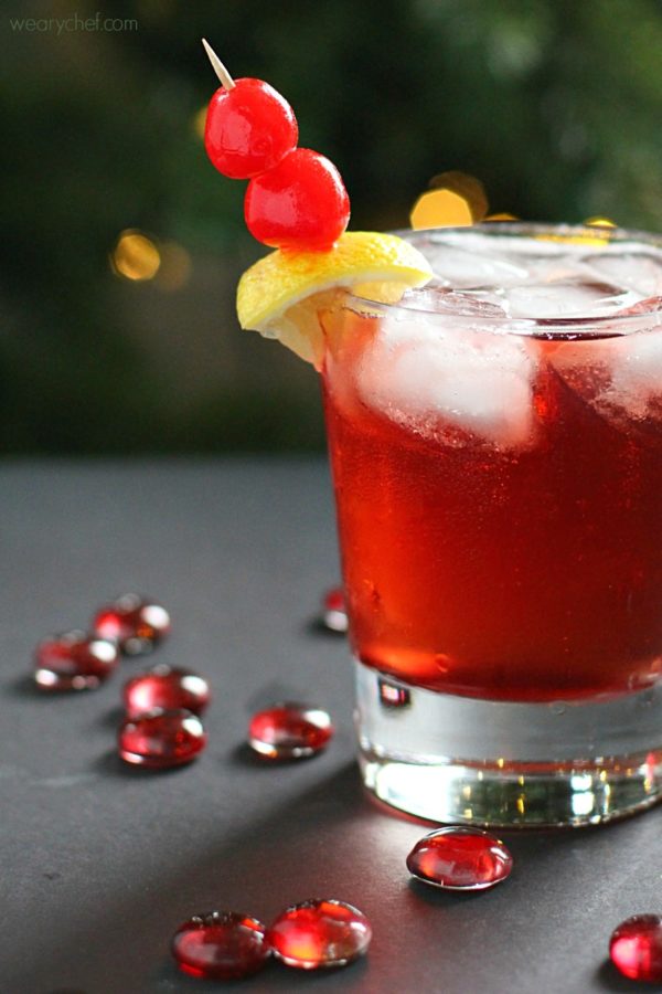 A glass of Cinnamon Cherry 7UP Cocktail with Bourbon.