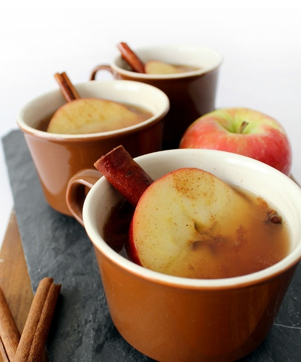 Mugs of Hot Cinnamon Cider Tea Punch.