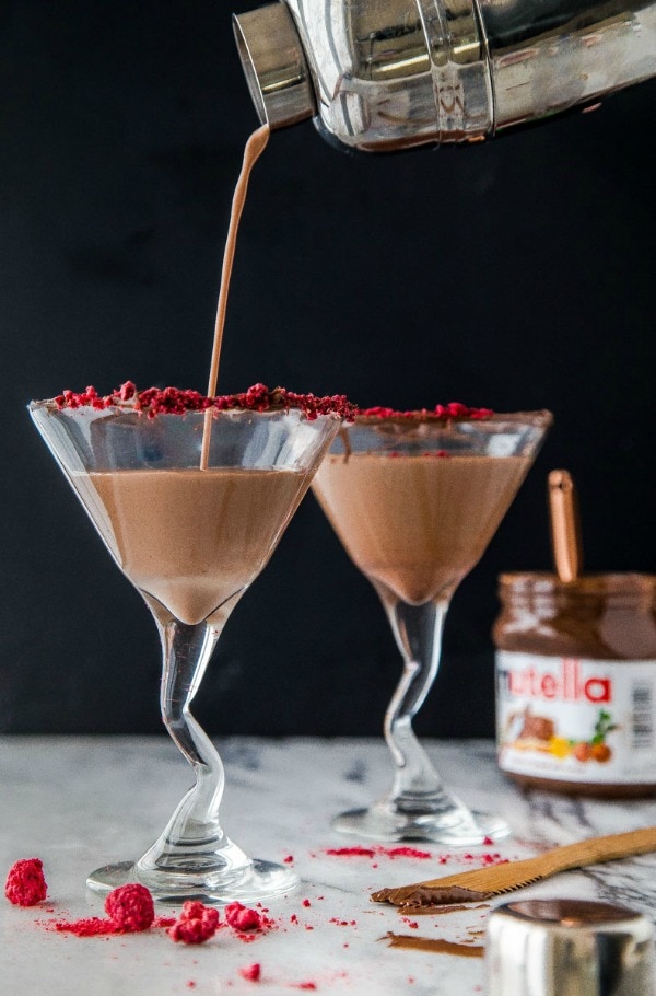 Nutella Raspberry Martini being poured into a martini glass.
