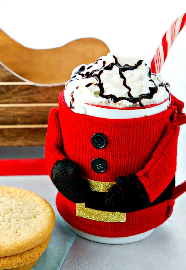 A mug of Spiked Mexican Hot Chocolate in a santa koozy.