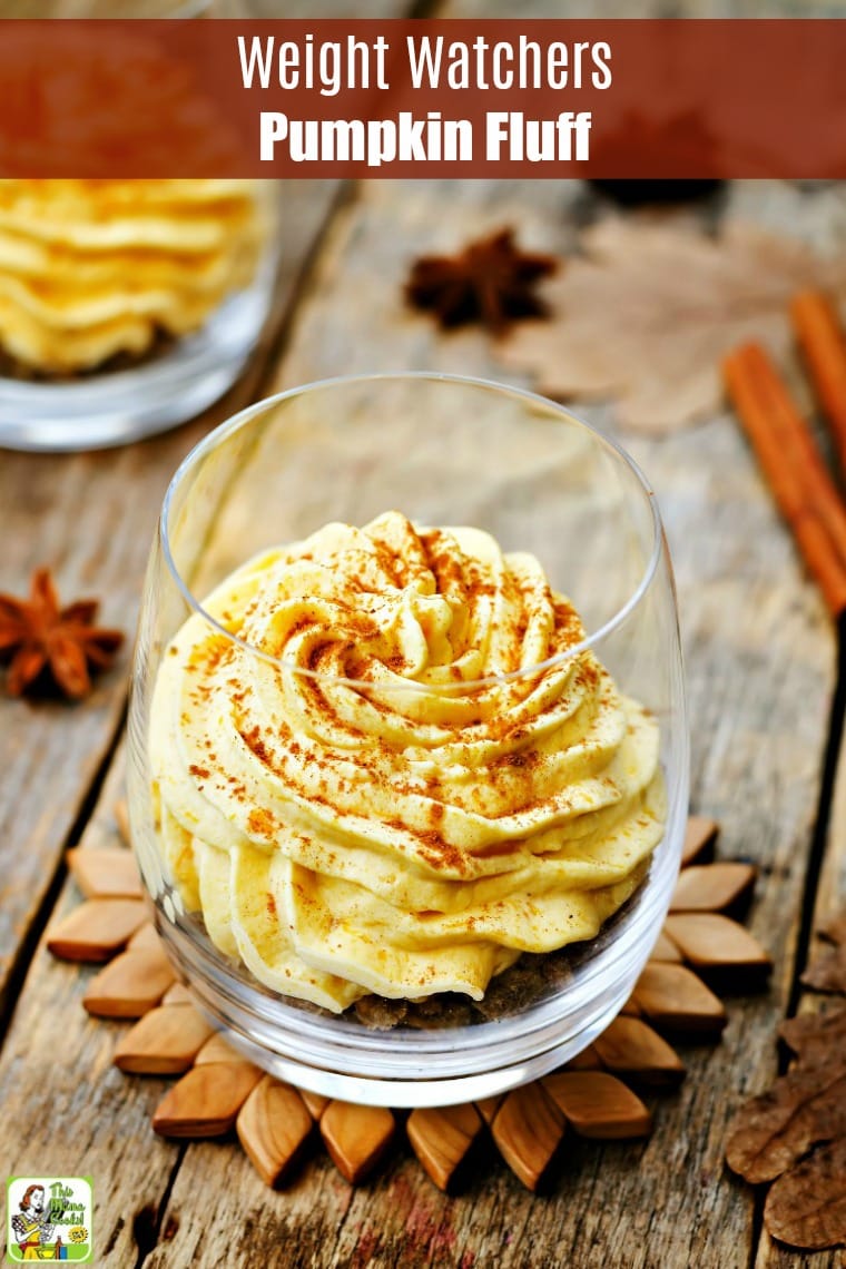 A glass filled with Pumpkin Mousse or pumpkin fluff on a wooden coaster.