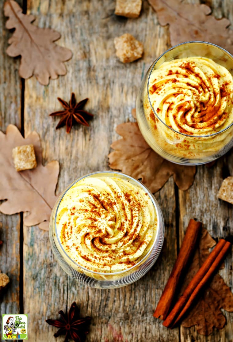 Overhead view of a glass filled with Weight Watchers Pumpkin Mousse or Weight Watchers Pumpkin Fluff with sugar cubes and cinnamon sticks.