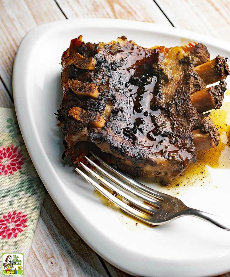 A plate of Crock-Pot Ribs with fork and floral napkin.