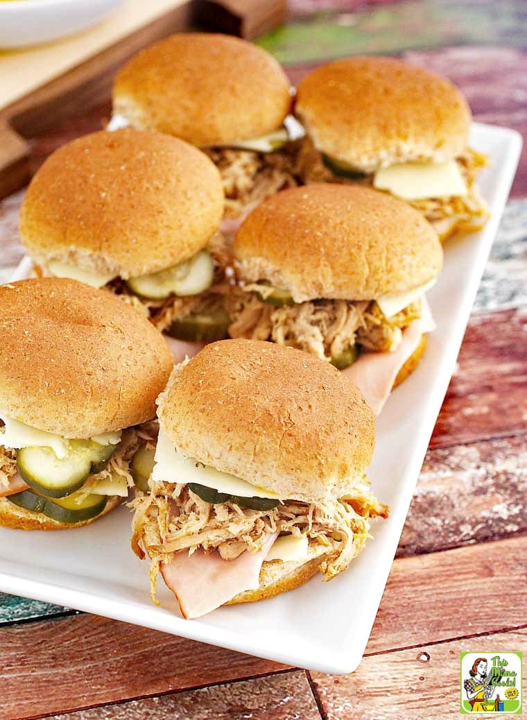 Cuban slider sandwich appetizers on a white platter.