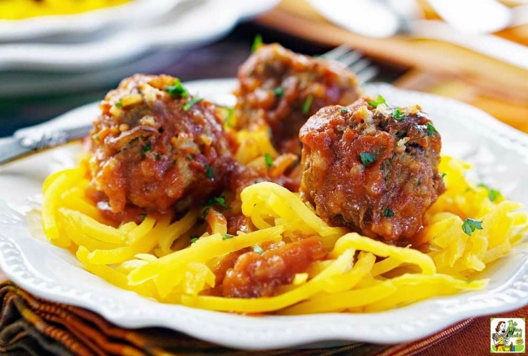 A plate of slow cooker porcupine meatballs on squash zoodles.