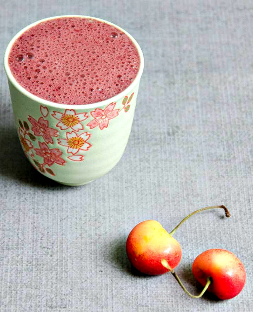 A cup of Sweet Dark Cherry Smoothie for Muscle Recovery.