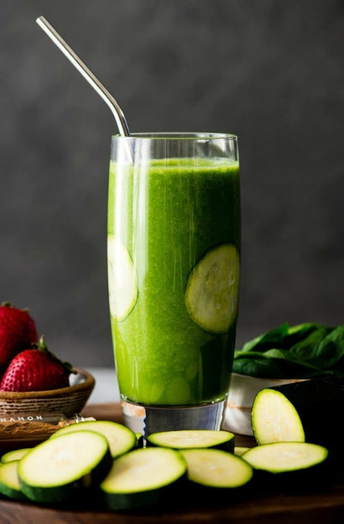 A glass of Zucchini Smoothie with zucchini slices.