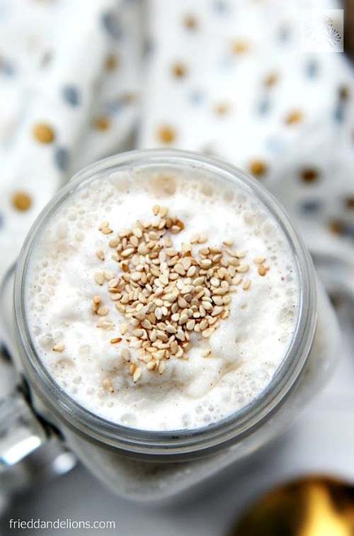 Overhead view of a glass of Tahini Date Shake.