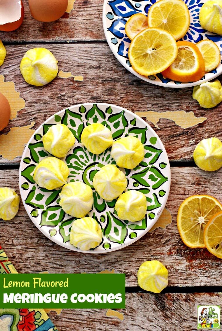 Colorful plates of yellow meringue cookies with slices of lemons.