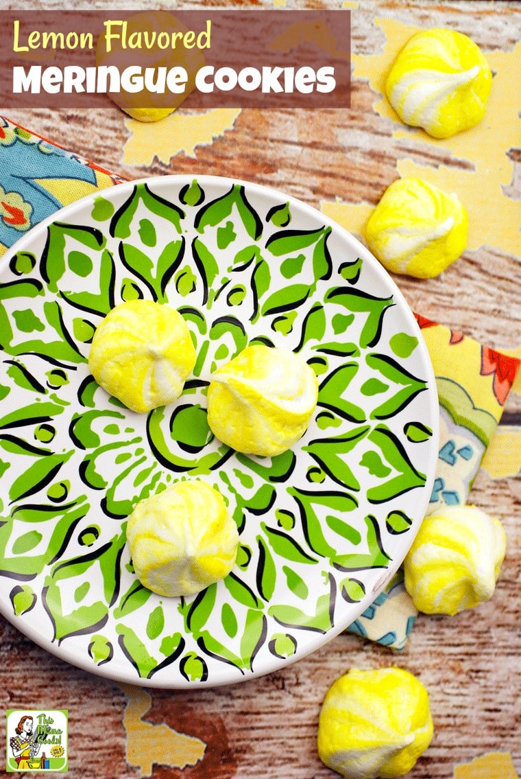 A green and white plate with yellow meringue cookies and colorful napkins.