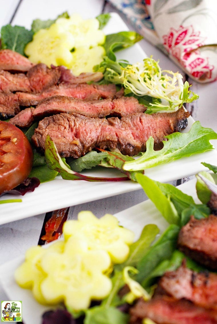 Closeup of plates of Flat Iron Steak Salad with Yogurt Dressing.