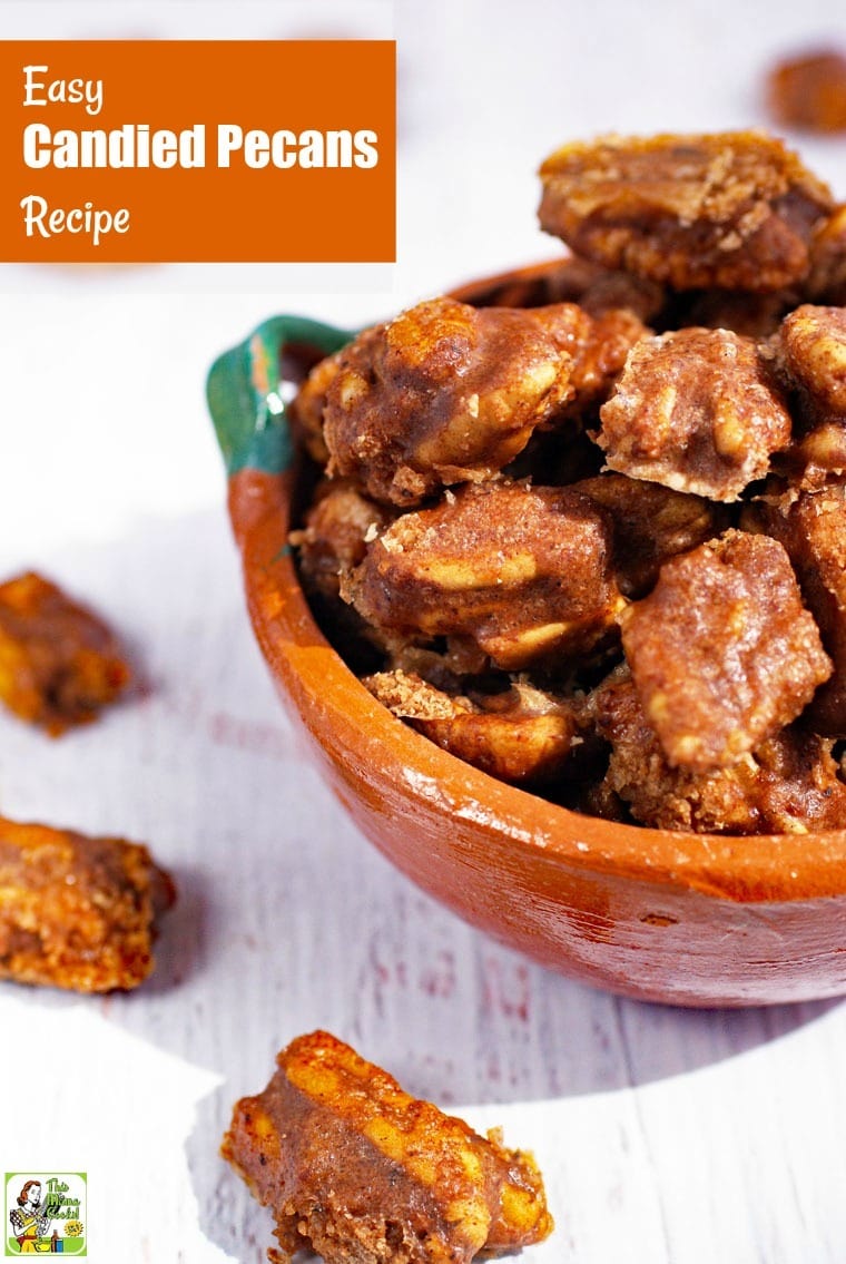 Closeup of a ceramic bowl of Candied Pecans.