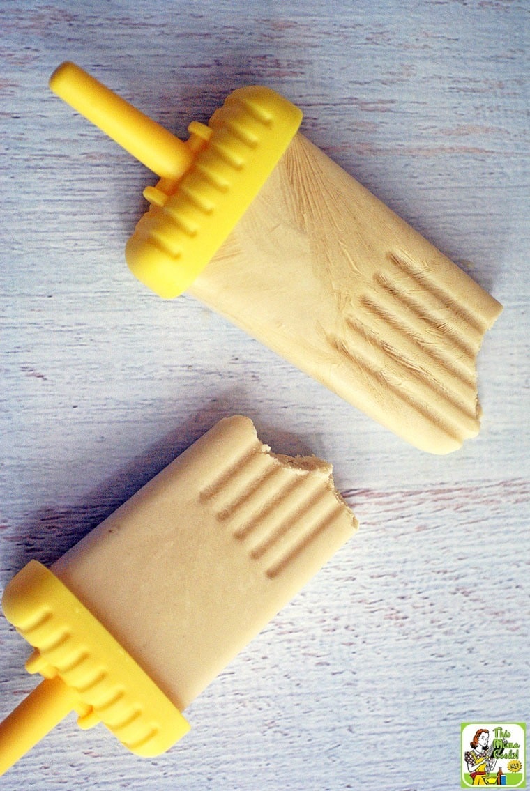 Two Yogurt Popsicles with yellow handles.