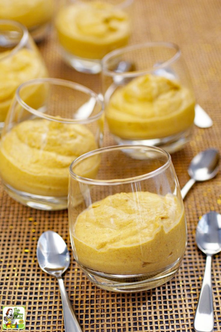 Keto Pumpkin Mousse in glass jars with silver spoons
