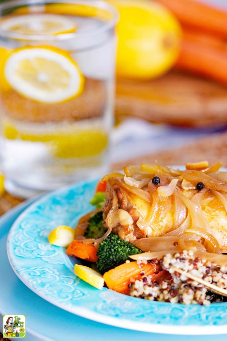 Blue plate of slow cooker chicken adobo with vegetables and quinoa