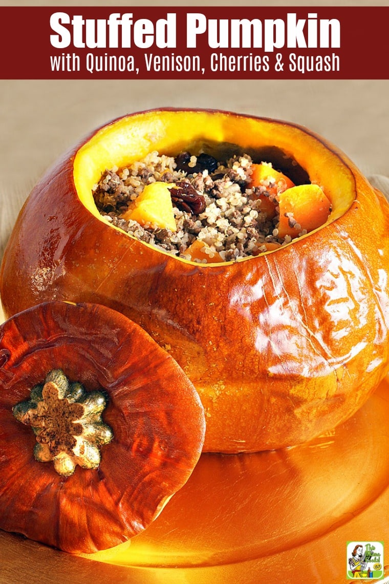 Quinoa Stuffed Pumpkin with Venison, Cherries & Squash on a golden platter.