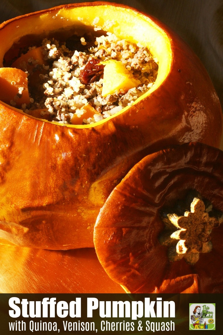 Closeup of a Quinoa Stuffed Pumpkin with Venison, Cherries & Squash with lid on a gold platter.