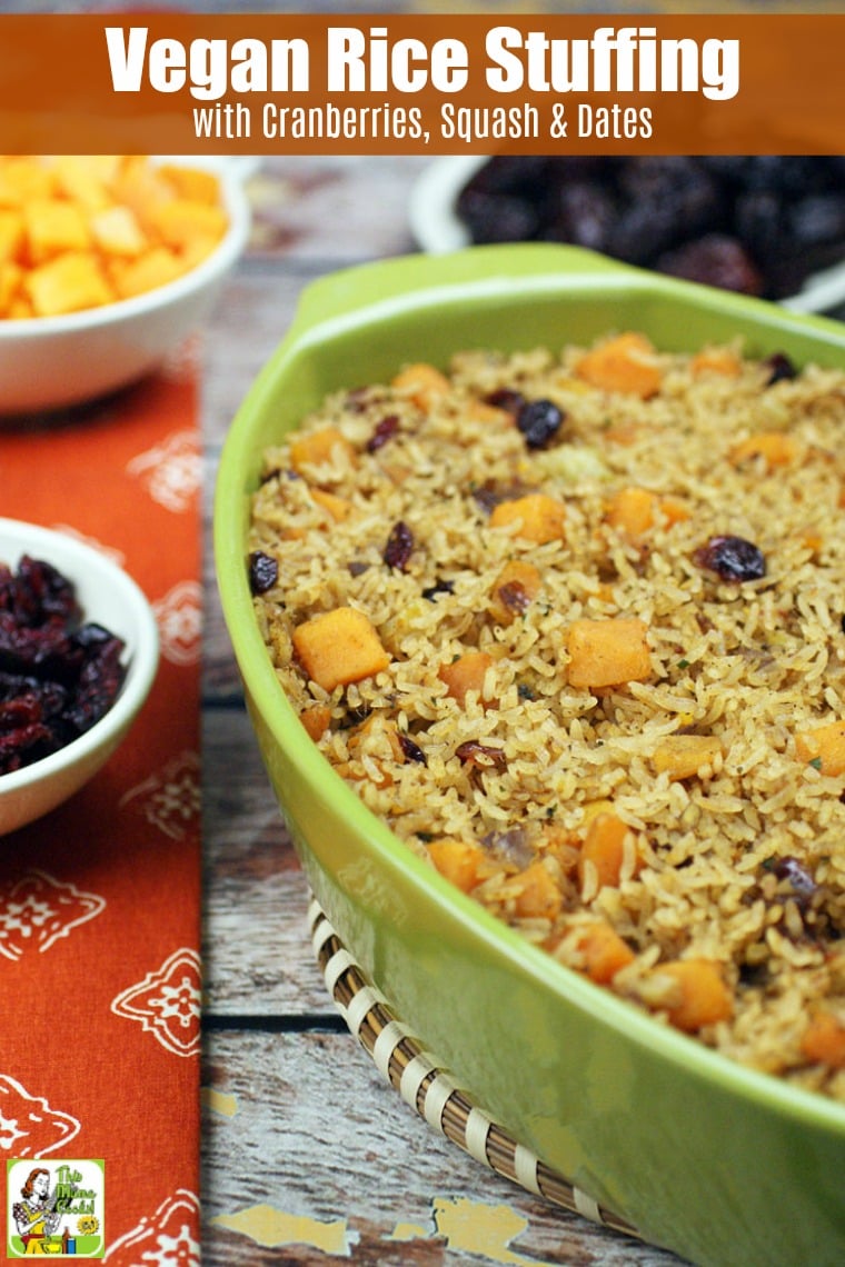 A casserole dish of rice stuffing with bowls of cranberries, squash and dates.