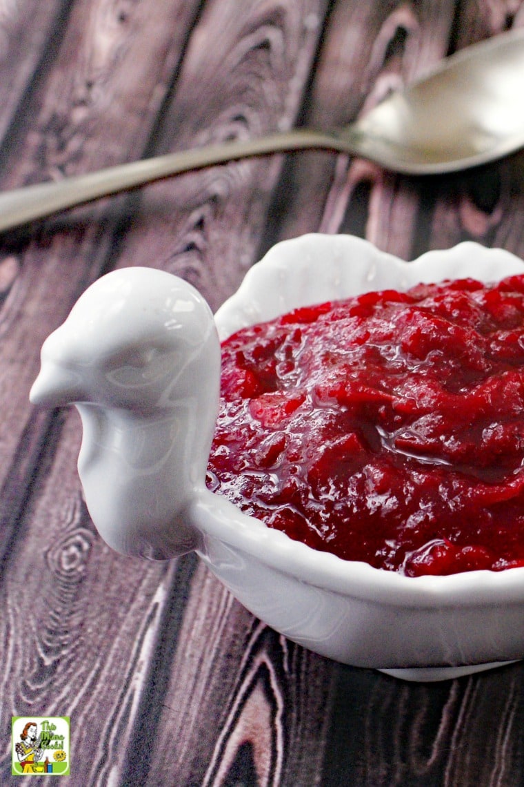 A white turkey shaped bowl of Cranberry Sauce.